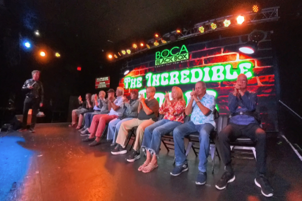 Comedy hypnotist Boris Cherniak performing live on stage