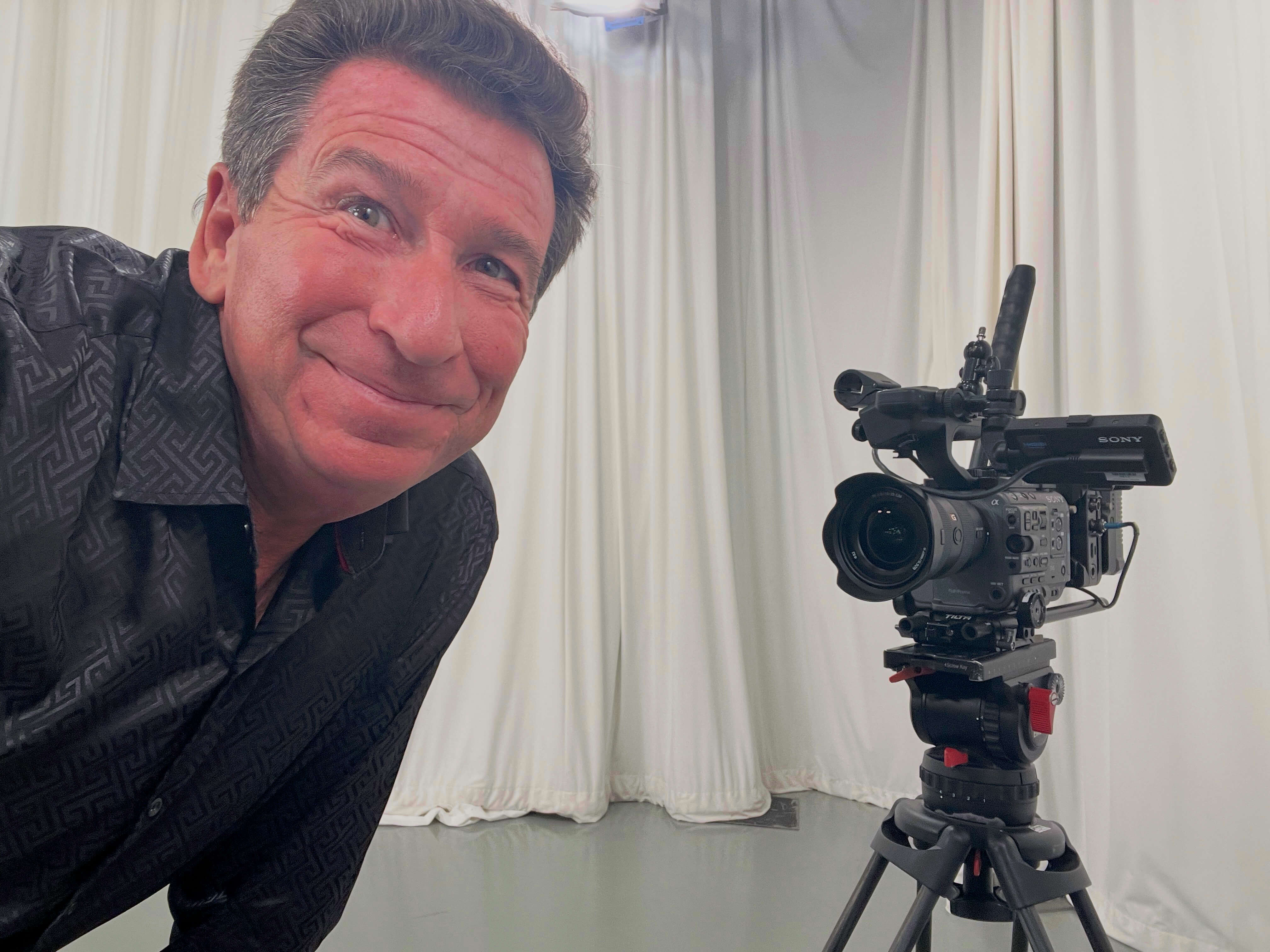 Comedy hypnotist Boris Cherniak performing on a television set