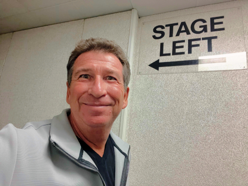 Comedy hypnotist Boris Cherniak performing interactive hypnosis show live at a comedy club