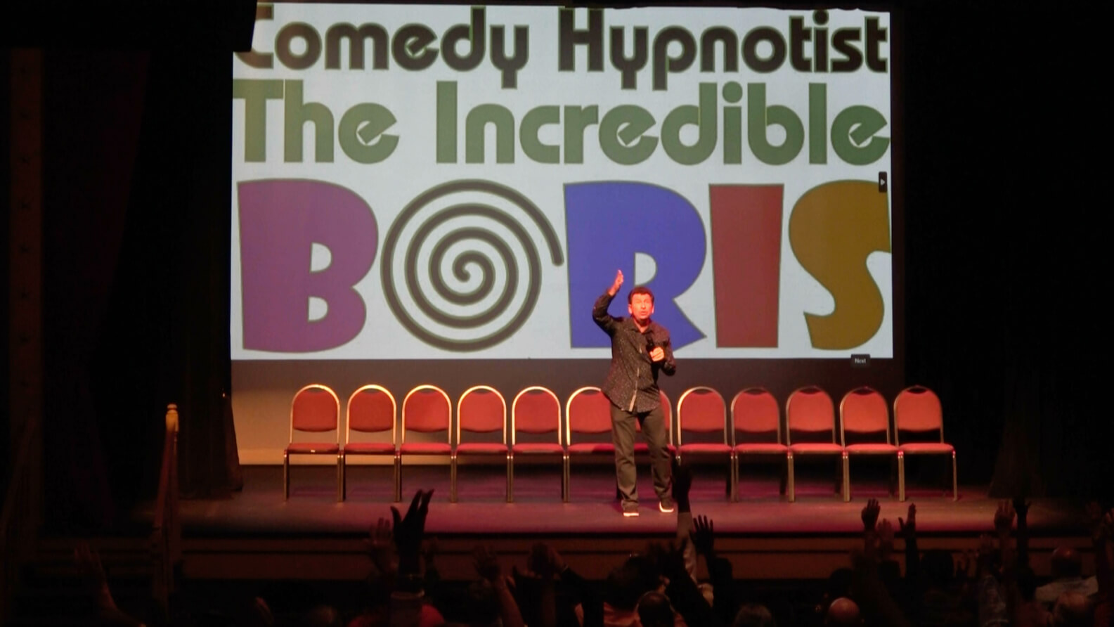 Comedy hypnotist Boris Cherniak performing live on stage