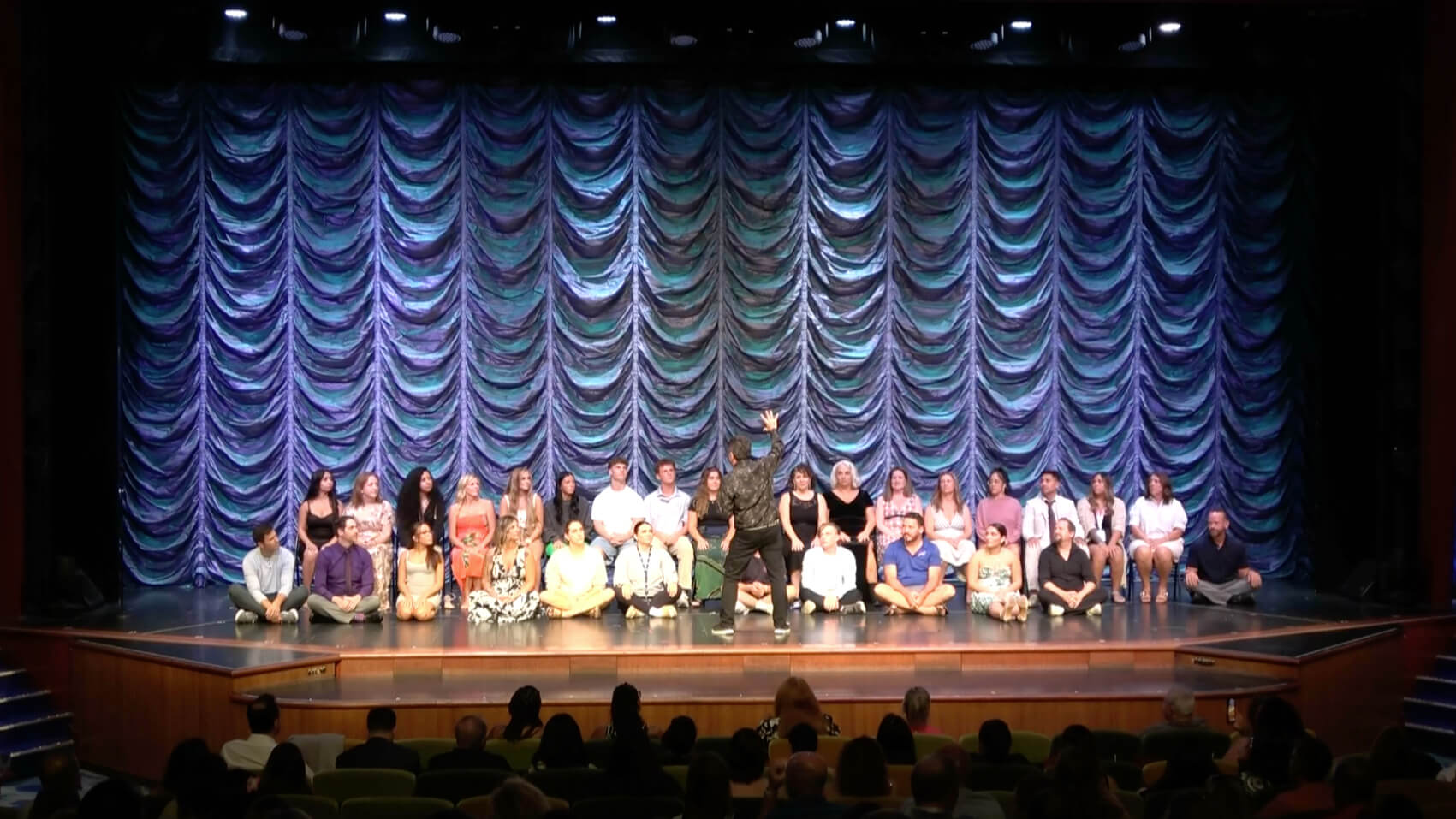 Boris Cherniak headlining comedy hypnosis show on cruise ship stage